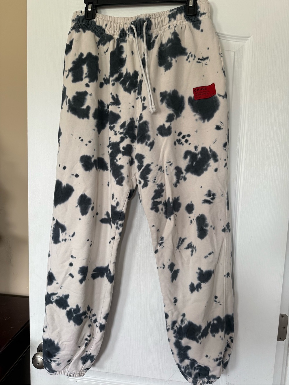 CHNGE Cream and Black Tie-Dye Joggers with Red Logo Patch